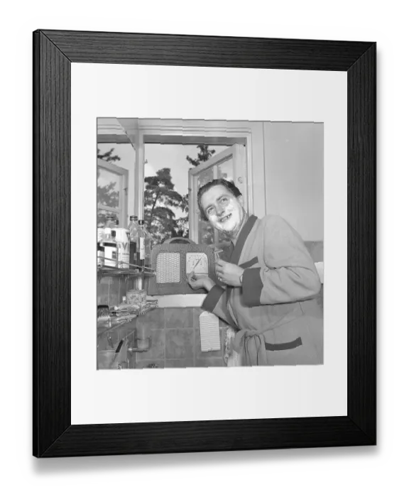 Framed Print : Stig Jarrel. 1910-1998. Swedish actor. Known for the role of the sadistic Latin teacher Caligula in Ingmar Bergman's film Hets. Here at home in the bathroom getting ready for the day, shaving and listening to the radio that is Framed Print : Stig Jarrel. 1910-1998. Swedish actor. Known for the role of the sadistic Latin teacher Caligula in Ingmar Bergman's film Hets. Here at home in the bathroom getting ready for the day, shaving and listening to the radio that is