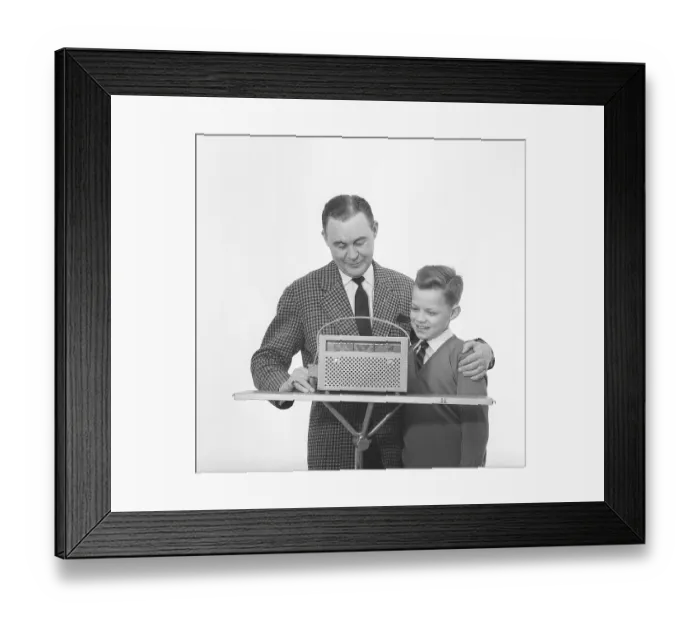 Framed Print : In the 1960s. Father and son with a radio Framed Print : In the 1960s. Father and son with a radio