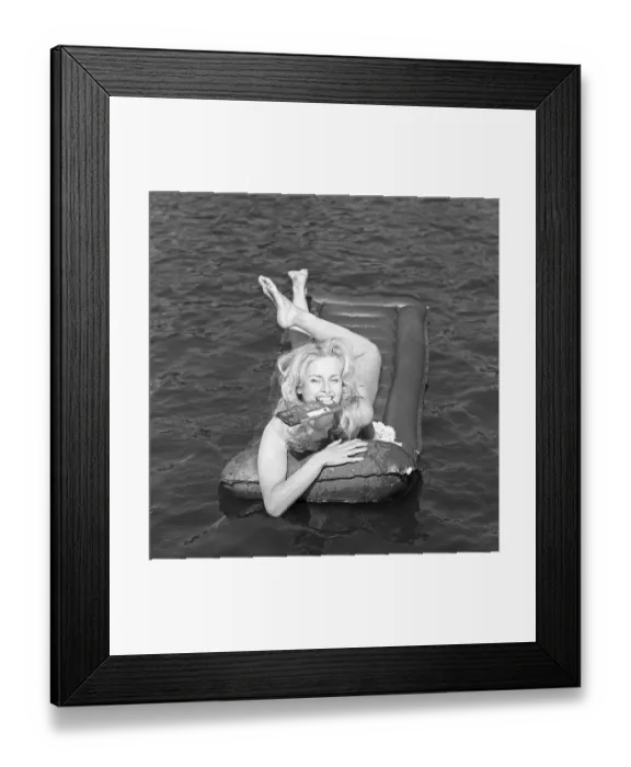 Framed Print : Mazetti chocolate. A young blonde woman with a chocolate bar between her teeth