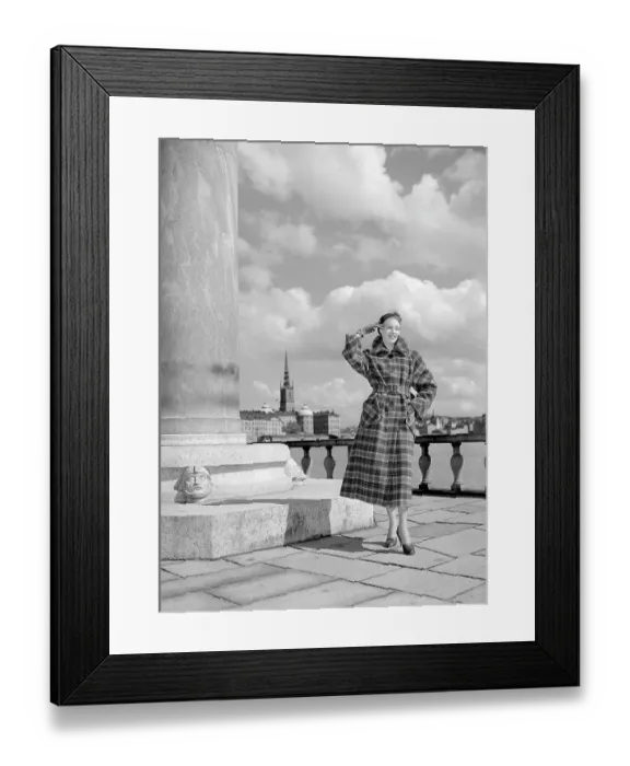 Framed Print : Fashionable in the 1950s. A young woman wears a typical 1950s coat