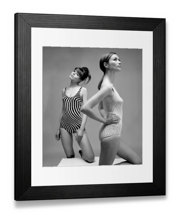 Framed Print : 1960s swimsuit fashion. Two models are wearing the swimsuit fashion of 1966 Framed Print : 1960s swimsuit fashion. Two models are wearing the swimsuit fashion of 1966