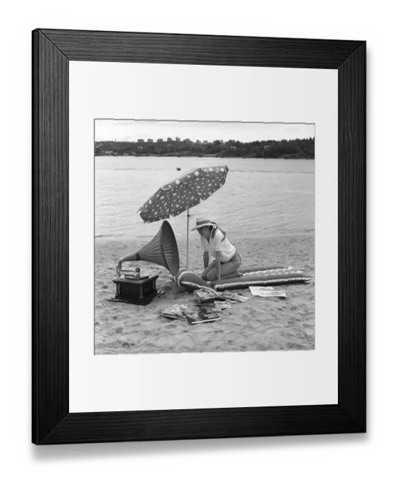 Framed Print : On the beach 1960. A young woman on a beach Framed Print : On the beach 1960. A young woman on a beach