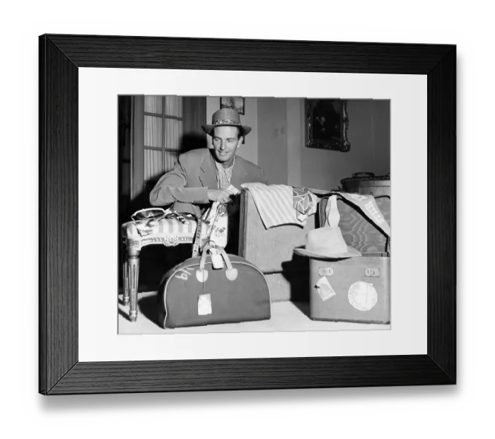 Framed Print : In the 1950s. A man with different kinds of luggage in front of him Framed Print : In the 1950s. A man with different kinds of luggage in front of him