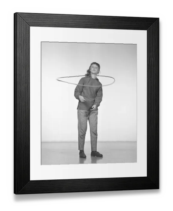 Framed Print : In the 1950s. A girl Hula hooping