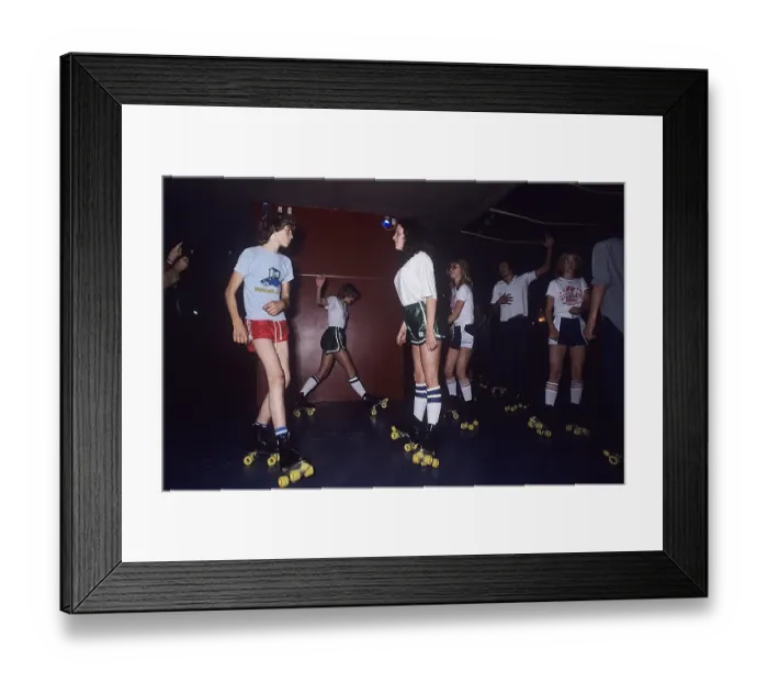 Framed Print : Roller skate fun in the 1970s. Interior of a roller disco with people roller skating