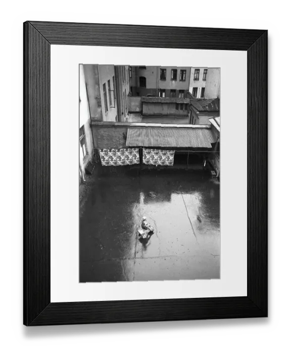 Framed Print : Stockholm in the 1950s. A child rides a tricycle in a backyard in central Stockholm Framed Print : Stockholm in the 1950s. A child rides a tricycle in a backyard in central Stockholm