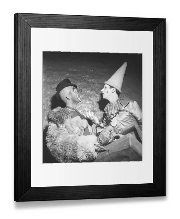 Framed Print : Circus clowns in the 1940s. Two clowns in different stage costumes are standing facing each other arguing and talking to each other. They are part of the Brazil Jack Circus. Sweden 1943. Kristoffersson ref F6-2