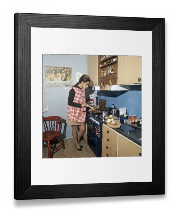 Framed Print : In the kitchen 1970s. Actress, singer Lill-Babs Svensson pictured in the typical 70s kitchen cooking a meal Framed Print : In the kitchen 1970s. Actress, singer Lill-Babs Svensson pictured in the typical 70s kitchen cooking a meal