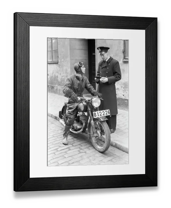 Framed Print : Motorcyclist in the 1950s. A young man dressed in the typical way the motorcyclists did in the 1950s