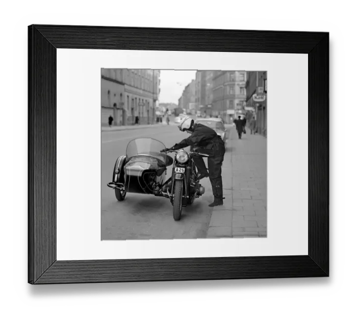 Framed Print : In the 1960s. A woman seen dressed in the typical motorcycle drivers outfit Framed Print : In the 1960s. A woman seen dressed in the typical motorcycle drivers outfit