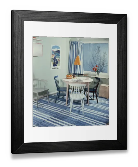 Framed Print : Kitchen in the past. A kitchen with a round kitchen table with four kitchen chairs