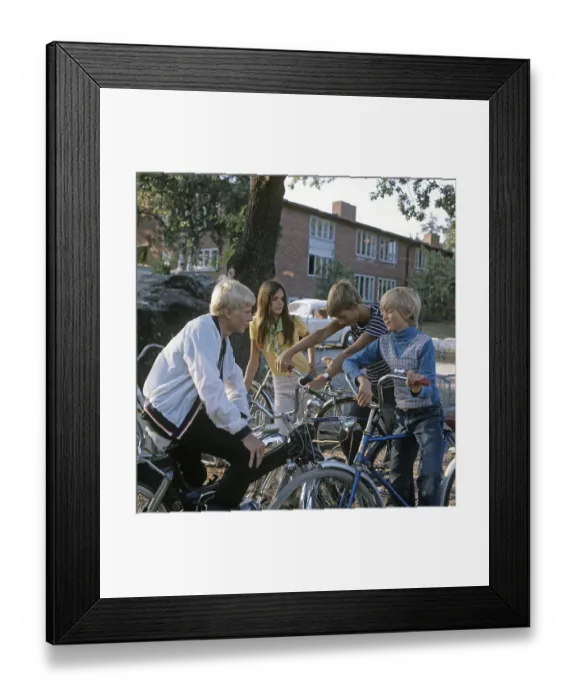 Framed Print : Teenagers in the 1960s. Four teenagers on the school yard after school