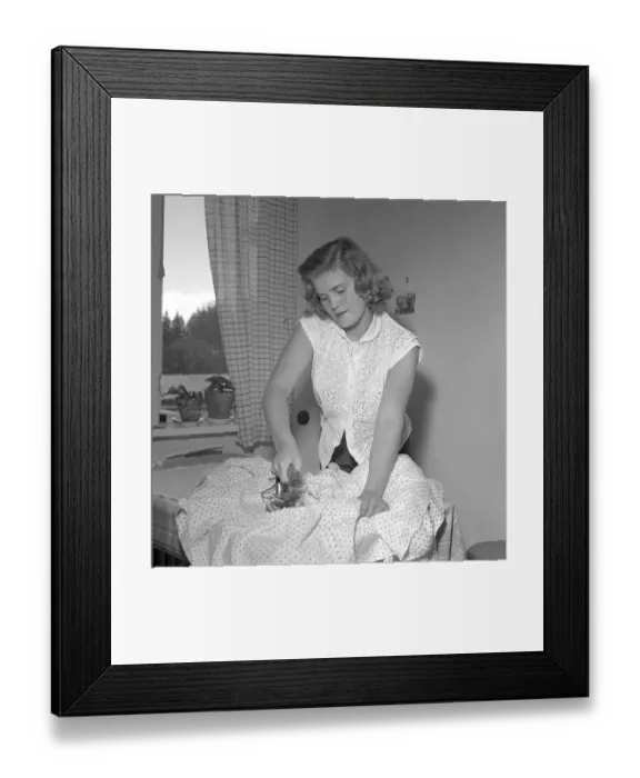 Framed Print : Ironing in the 1950s. A woman seen ironing her clothes. She is actress Sonja Stjernquist 1931-2002. Sweden 1951. Conard ref 1743 Framed Print : Ironing in the 1950s. A woman seen ironing her clothes. She is actress Sonja Stjernquist 1931-2002. Sweden 1951. Conard ref 1743