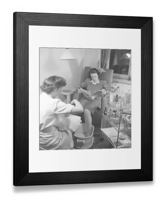 Framed Print : A young woman in a beauty salon gets a pedicure Framed Print : A young woman in a beauty salon gets a pedicure