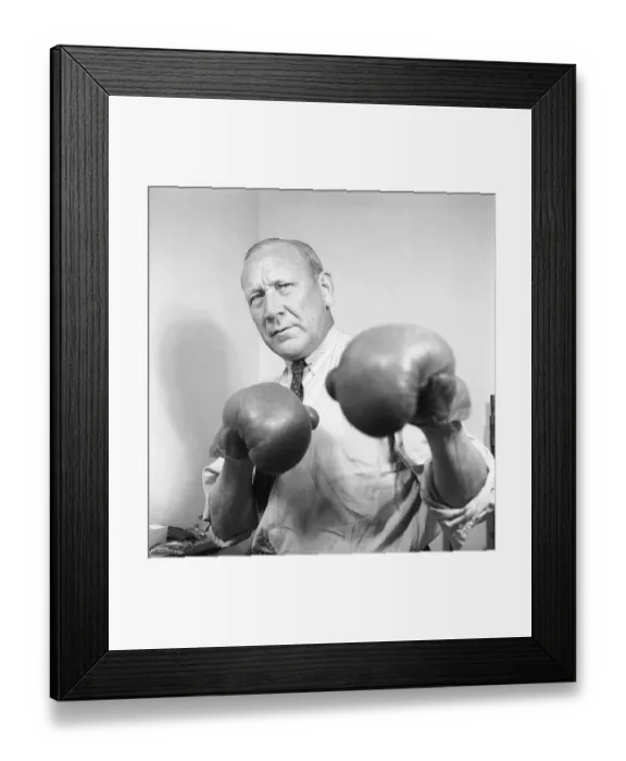 Framed Print : Age is just a number. An older man in a shirt and tie wears boxing gloves and he stands as a boxer should, with his guard up to block a punch but at the same time ready to strike