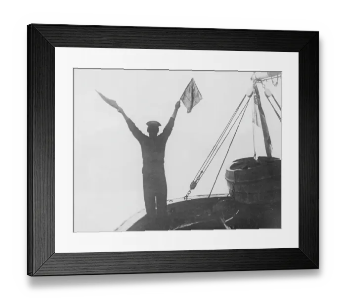 Framed Print : During The Great War 1914-1918. A sailor seen signalling from one British warship to another. Depending on how the two flags were positioned, the combinations meant different letters and numbers