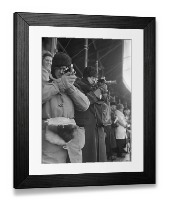 Framed Print : Amateur photographers film with narrow-film cameras during the bandy match at the Stockholm stadium between Sweden Framed Print : Amateur photographers film with narrow-film cameras during the bandy match at the Stockholm stadium between Sweden