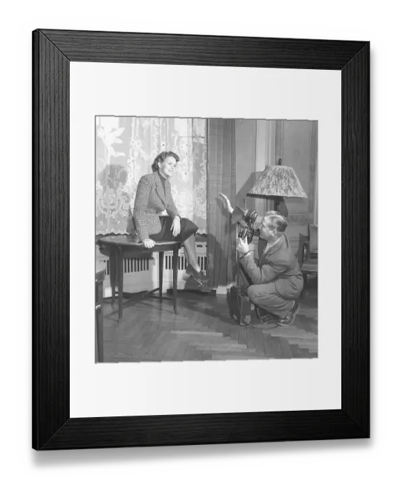 Framed Print : A professional photographer arranges the photo model Haide Goeranson so that he gets a good Framed Print : A professional photographer arranges the photo model Haide Goeranson so that he gets a good