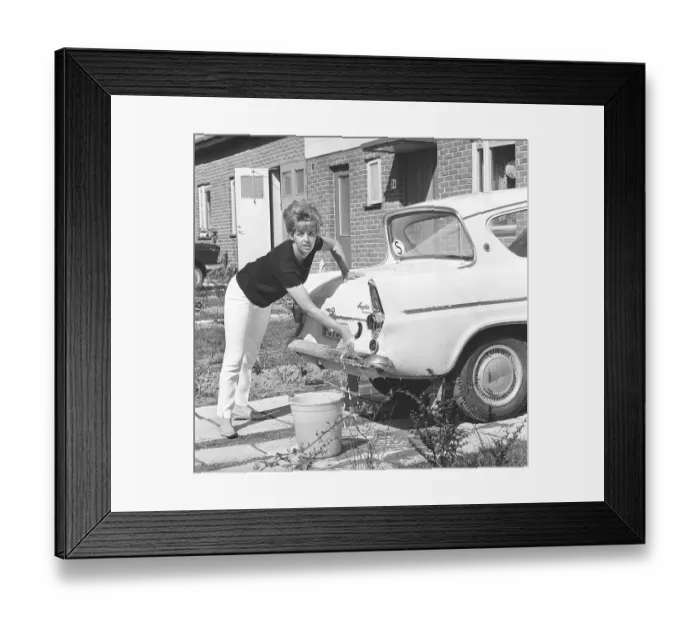 Framed Print : In the 1960s. Actress singer Lill-Babs washing her car Framed Print : In the 1960s. Actress singer Lill-Babs washing her car