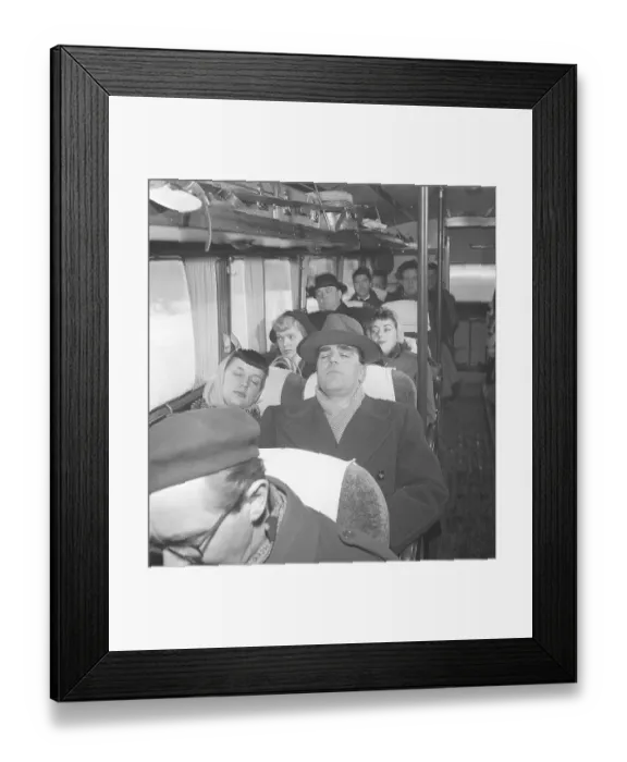 Framed Print : Having a nap in the 1950s. A man has fallen asleep during a bus ride