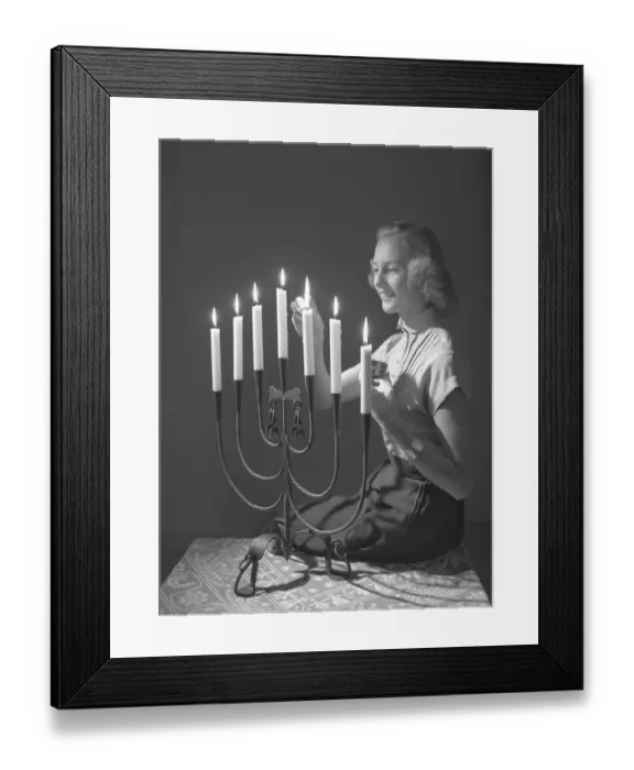 Framed Print : Christmas in the 1950s. Margit Sjoedin is lighting the candles at christmas