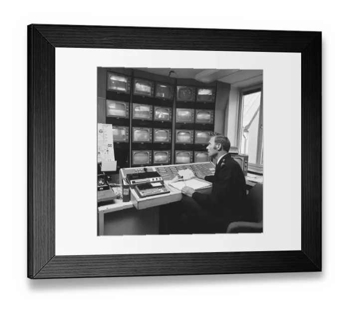 Framed Print : Subway safety in the 1970s. The feed from the subway surveillance cameras are monitored Framed Print : Subway safety in the 1970s. The feed from the subway surveillance cameras are monitored