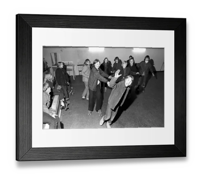 Framed Print : Roller skate fun in the 1960s. Interior of a roller disco with people roller skating