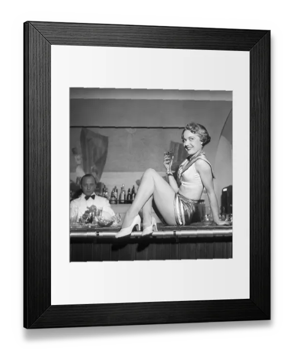 Framed Print : Party in the 1950s. A smiling young woman dressed in a costume however small Framed Print : Party in the 1950s. A smiling young woman dressed in a costume however small