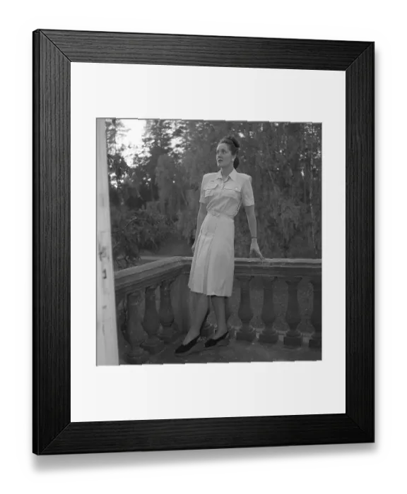 Framed Print : Women's fashion in the 1940s. A young woman photographed for a ladies magazine to show the women's fashion of 1945