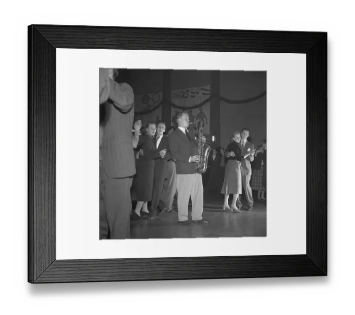 Framed Print : Dancing in the 1950s. The dance floor is filled with dancing couples moving to the music