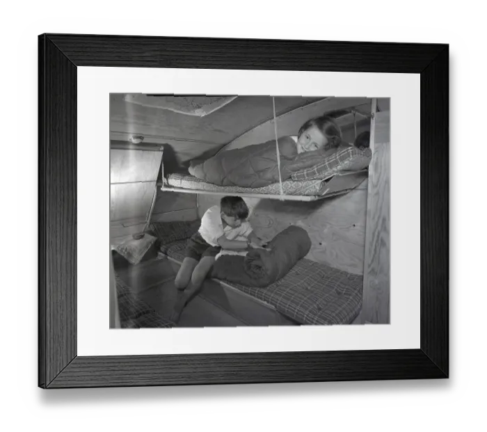 Framed Print : 1950s camping. A family is enjoying their holiday and the practial camping life in their caravan