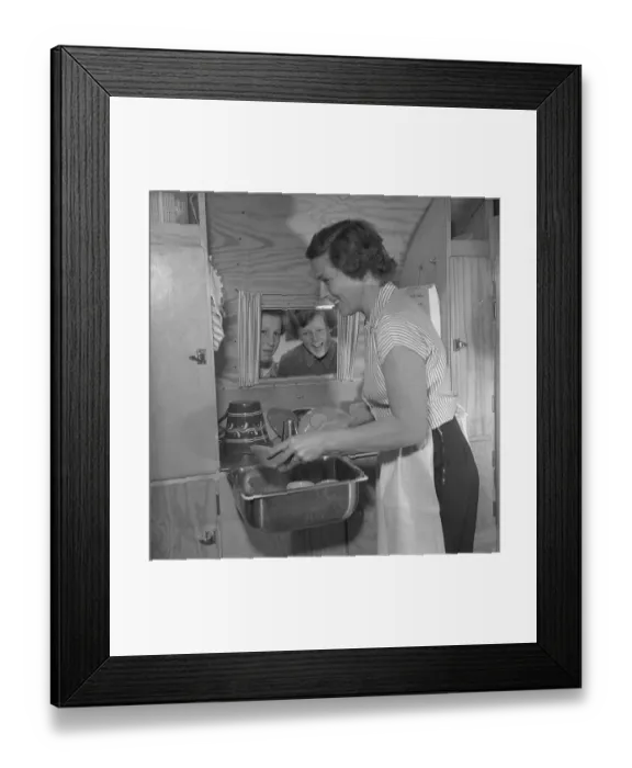 Framed Print : 1950s camping. A family is enjoying their holiday and the practial camping life in their caravan