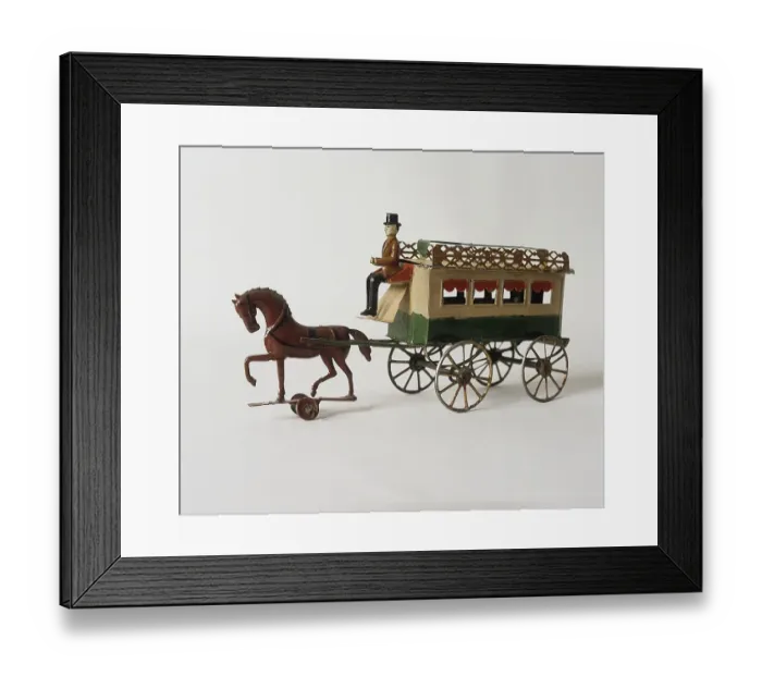 Framed Print : Childrens toys from the past. Two tin toys that were popular around the turn of the century 1800-1900