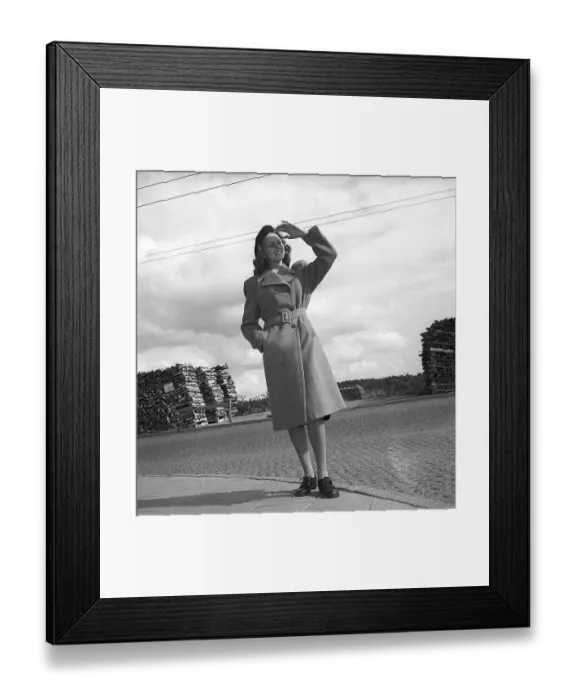 Framed Print : Women's fashion in the 1940s. A young woman in a typical 1940s coat Framed Print : Women's fashion in the 1940s. A young woman in a typical 1940s coat