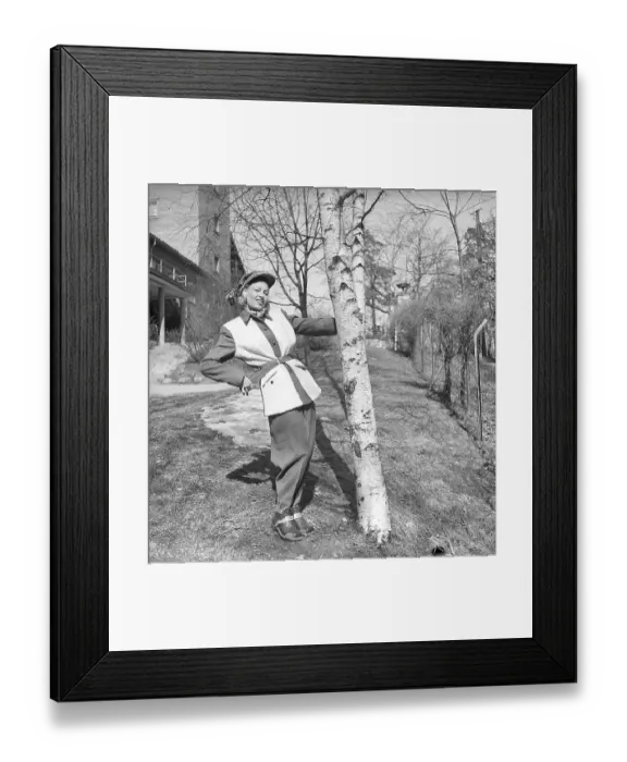 Framed Print : Dressed for autumn and winter in the 1940s A young woman is wearing a jacket