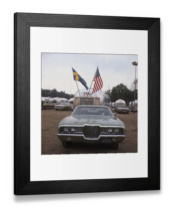 Framed Print : 1970s camping. Pictured an American Airstream caravan in aluminium and in the typical 1930s streamline design Framed Print : 1970s camping. Pictured an American Airstream caravan in aluminium and in the typical 1930s streamline design