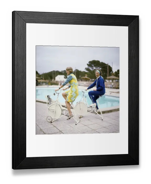 Framed Print : In the 1960s. Two women on a charter trip to Spain are using their vacation to exercise
