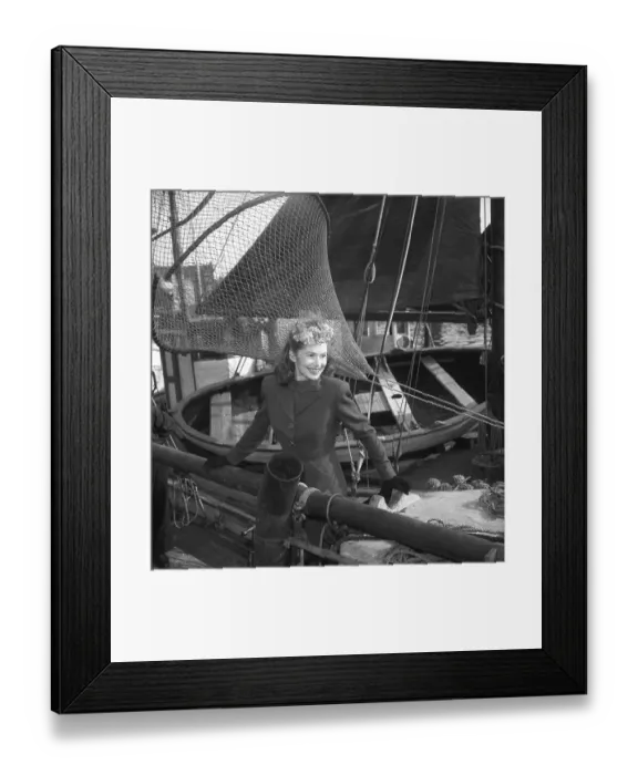 Framed Print : Women's fashion in the 1940s. A young woman in a typical 1940s jacket and skirt Framed Print : Women's fashion in the 1940s. A young woman in a typical 1940s jacket and skirt