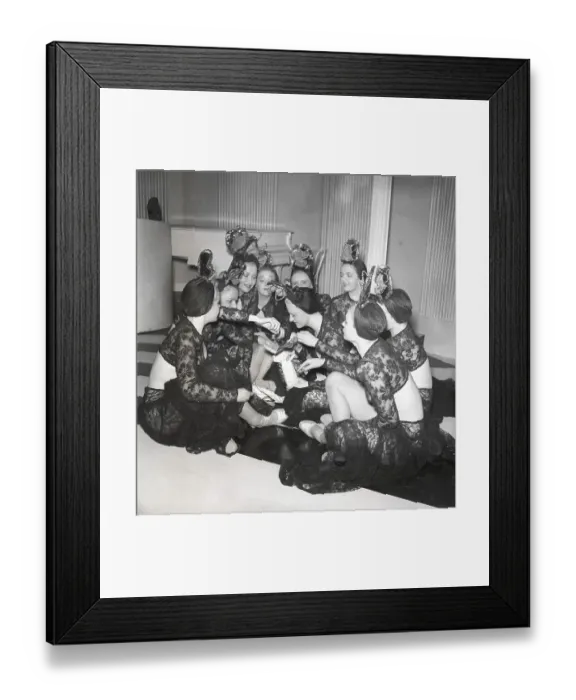 Framed Print : Chocolate in the 1940s. A group of women are eating from a box of chocolates on a film set