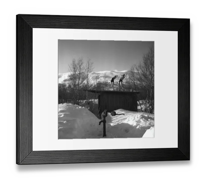 Framed Print : Winter in the 1940s. A young couple is enjoying their winter vacation in Swedish Lapland