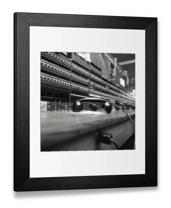 Framed Print : Telephony in the 1970s. Interior from an empty room with a large switchboard visible