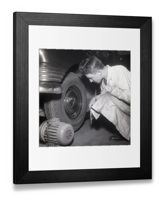 Framed Print : Cars in the 1950s. At this time the yearly mandatory checkup and control of cars was not in affect. Picture taken at the garage of the Swedish Royal Automobile club where a car is controlled that everything is in working order. Sweden 1951
