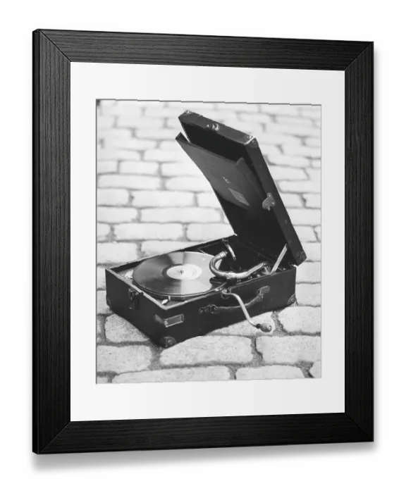 Framed Print : Gramophone. A portable gramophone by manufacturer His masters voice