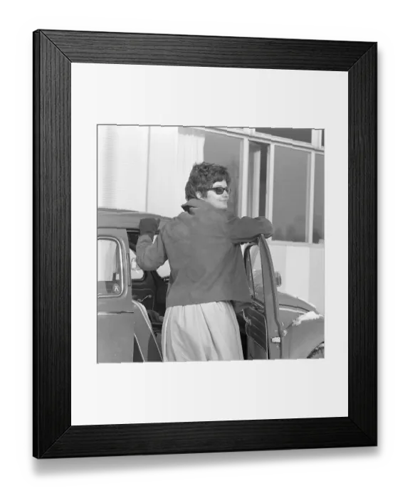 Framed Print : Driving in the 1960s. A woman at her car a Volkswagen Beetle. She is wearing a skirt, a short leather jacket, sunglasses and gloves. Sweden 1962 Framed Print : Driving in the 1960s. A woman at her car a Volkswagen Beetle. She is wearing a skirt, a short leather jacket, sunglasses and gloves. Sweden 1962
