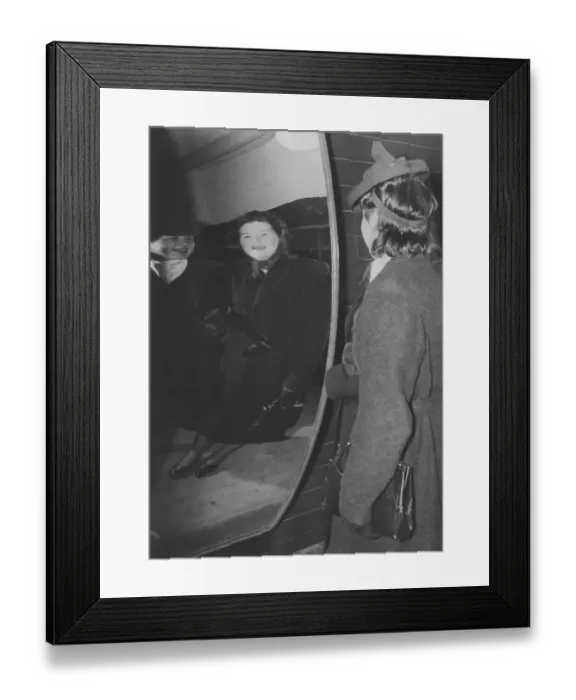 Framed Print : Amusement park in the 1940s. Two women are laughing at how they look in a funny mirror