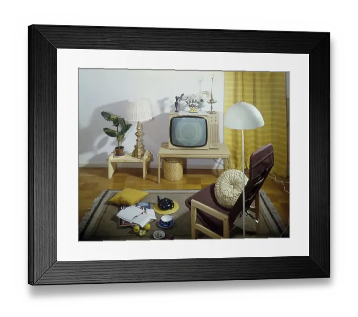 Framed Print : Television in the 1960s. Interior from a room with a typical 1960s television set on a special tv furniture