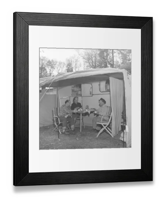 Framed Print : 1950s camping. Three people are sitting by their caravan enjoying a cup of coffee