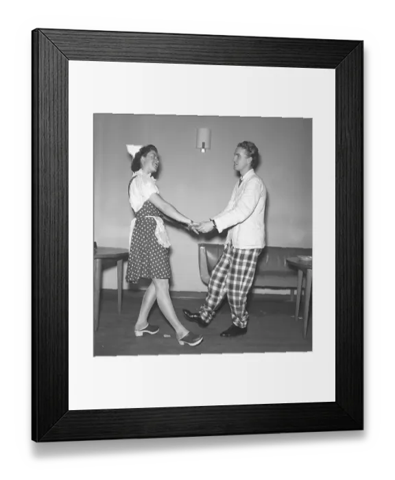 Framed Print : Dancing in the 1940s. A young couple at the theatre dancing together in their stage costumes