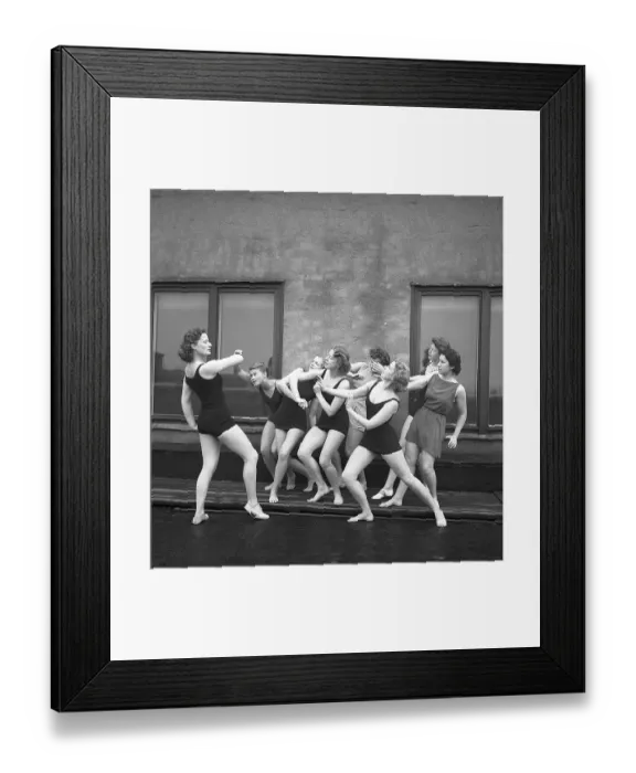 Framed Print : Gymnasts in the 1940s. A group of women gymnasts are training together on a top of a building Framed Print : Gymnasts in the 1940s. A group of women gymnasts are training together on a top of a building