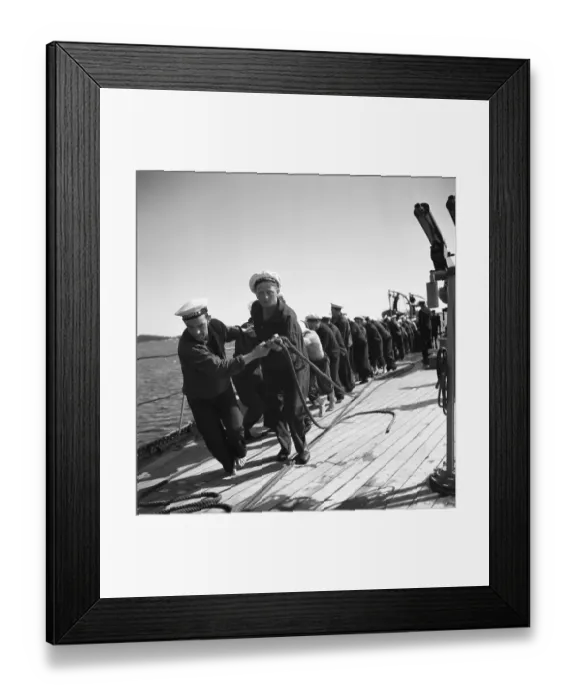 Framed Print : During World war II. The war ship Sverige during navy exercises at sea. The sailors are all pulling something heavy on deck, like an anchor line. Sweden june 1940. Kristoffersson ref 141 Framed Print : During World war II. The war ship Sverige during navy exercises at sea. The sailors are all pulling something heavy on deck, like an anchor line. Sweden june 1940. Kristoffersson ref 141